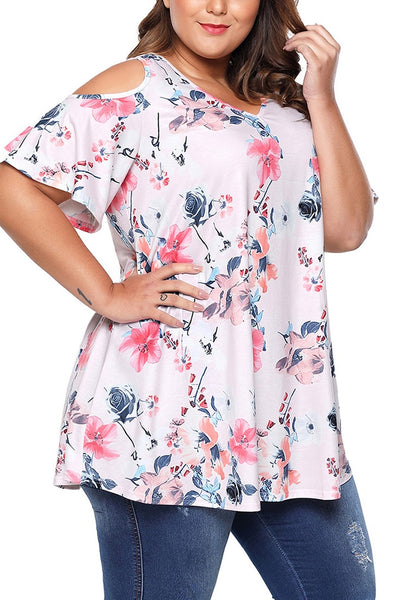 Model wearing plus size light pink floral cold-shoulder blouse