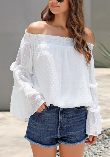 Model wearing white bell sleeves dotted loose off-shoulder top