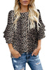 Model poses wearing black trumpet sleeves keyhole-back leopard blouse