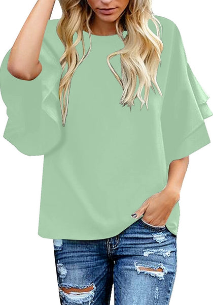 Model poses wearing mint green trumpet sleeves keyhole-back blouse