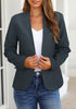 Model poses wearing navy V-neckline single button blazer