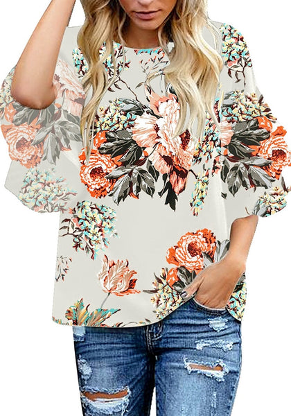 Model posses wearing apricot trumpet sleeves keyhole-back printed blouse