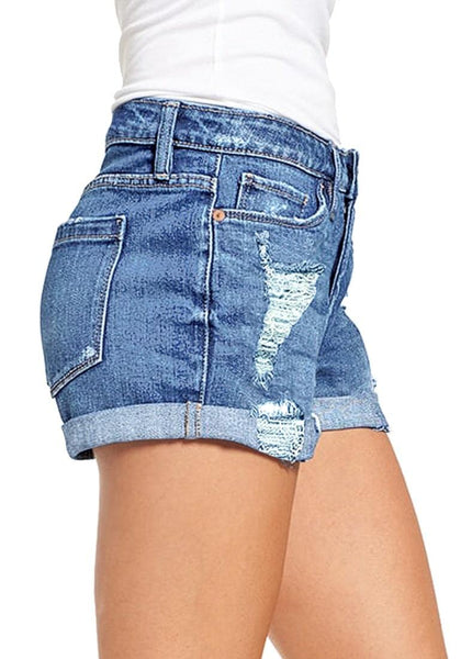 Side view of model in light blue roll-over hem button-up distressed denim shorts