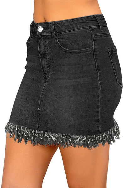Side view of model wearing black frayed hem washed denim mini skirt