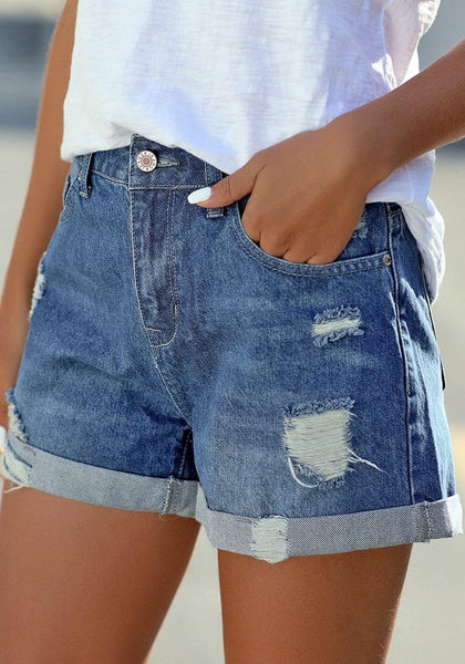 Side view of model wearing blue roll-over distressed denim shorts