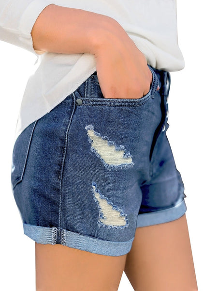 Side view of model wearing blue roll-over hem button-up ripped denim shorts