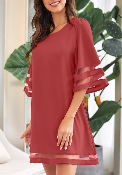 Side view of model wearing coral pink 34 bell sleeves mesh panel crew-neckline loose dress