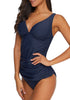 Side view of model wearing navy V-neckline scallop tie-back tankini set