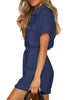 Side view of model wearing navy blue short sleeves button-down belted romper