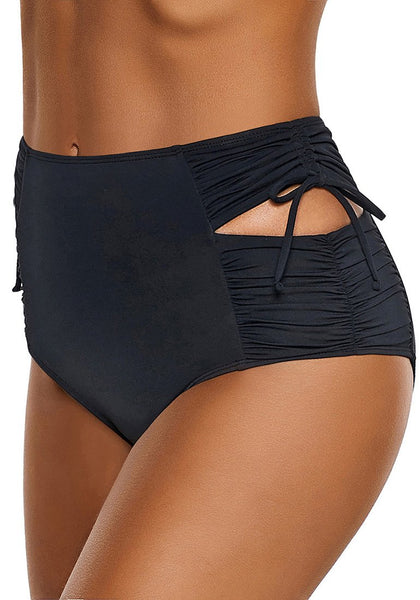 Side view of model wearing black high-waist cutout drawstring ruched bikini bottom