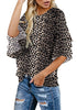 Side view of model wearing black trumpet sleeves keyhole-back leopard blouse